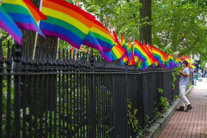 LGBTQ Pride flags adorn the fence outside Christopher Park in the West Village.